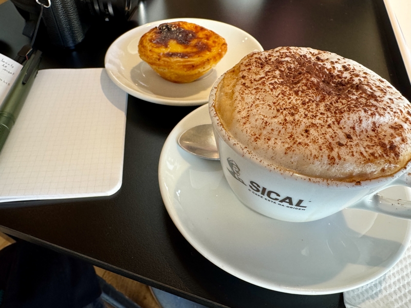 A cappuccino and pastel de nata at Pastelaria Santo António A cappuccino and pastel de nata at Pastelaria Santo António