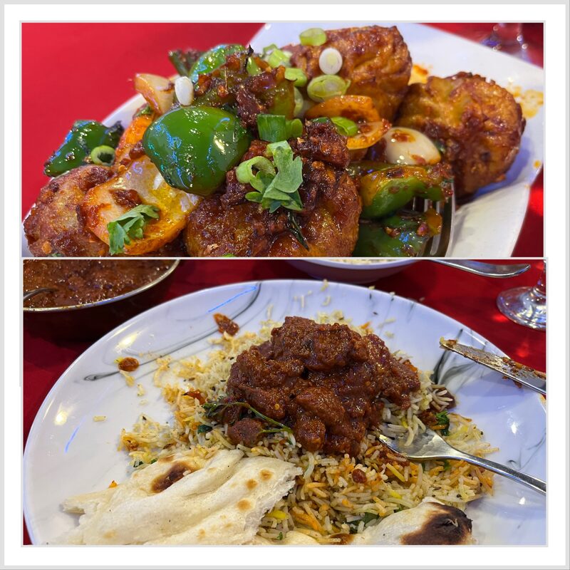 A plate of rice with hot spicy lamb vindaloo on top with naan bread on the side