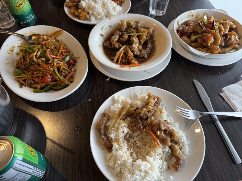 Checked in: Fan’s Chinese Restaurant Three dishes of Chinese food on a dark brown table
